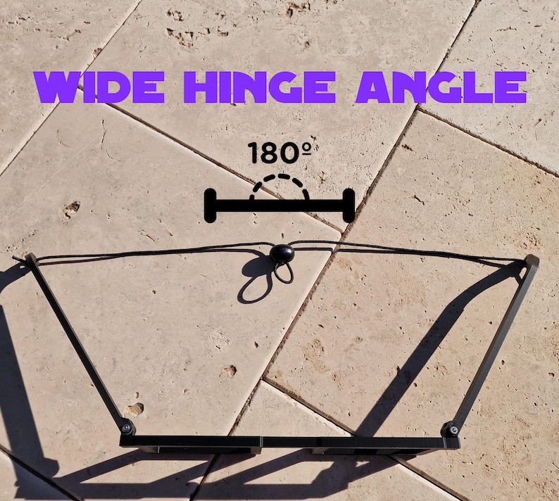 May include: Black metal hinge with a wide angle design, shown open. The text "WIDE HINGE ANGLE" is displayed in purple, with "180&deg;" indicating the angle of the hinge.