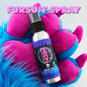 May include: A silver spray bottle with a black cap and a label that reads "NEON DRIFT" is held by a blue and pink furry paw. The text "FURSUIT SPRAY" is above the bottle. The bottle contains 80ml (2.7 fl oz) of product.