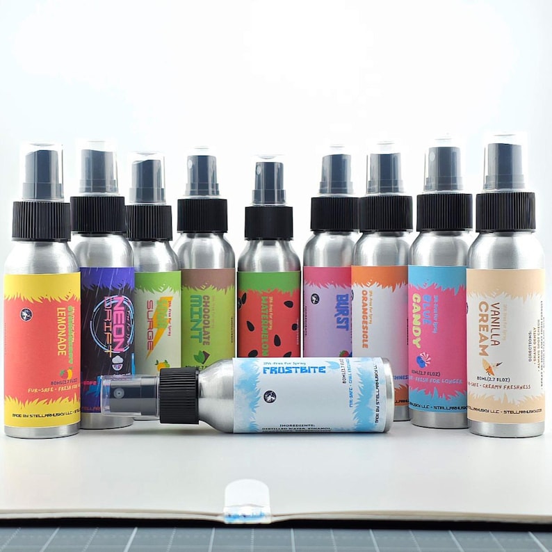 May include: A collection of aluminum spray bottles with black caps and colorful labels. Flavors include Lemonade, Neon Drift, Surge, Mint, Chocolate, Watermelon, Burst, Orange, Candy, Vanilla Cream, and Frostbite.