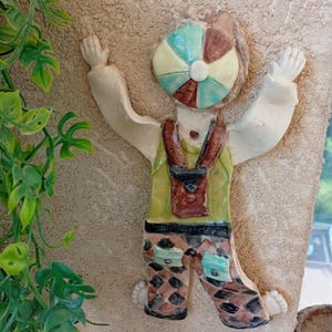 Handmade Clay Wall Sculpture: Colorful Cap Climber Art