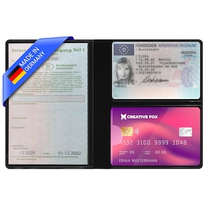 Könnte beinhalten: Schwarzes Lederportemonnaie mit blauem Band mit der Aufschrift "MADE IN GERMANY" und deutscher Flagge. Das Portemonnaie enthält einen Führerschein, eine Fahrzeugzulassung und eine Creative Fox Kreditkarte.