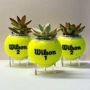 May include: A rustic wooden sign with the text "Welcome to our home" in white lettering. The sign features a distressed finish and a simple, inviting design, perfect for a front porch or entryway.