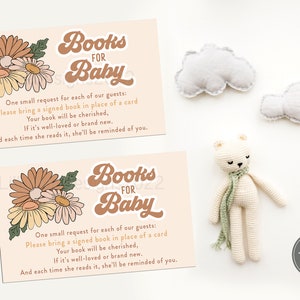 May include: Two cards with a floral design and the text "Books for Baby". The text requests guests to bring a signed book in place of a card for the baby.