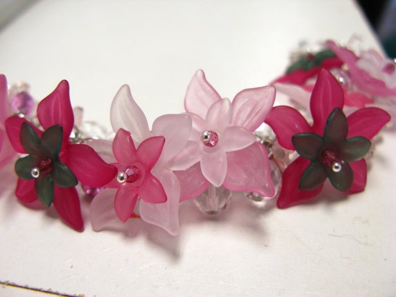 Items similar to Rose Hues Lucite Flower and Glass Charm Bracelet ...