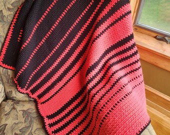 Crochet baby blanket in pink and black stripes