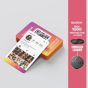 May include: A stack of business cards with a gradient design, featuring an Instagram profile display. The cards have a QR code and the text "Follow Us". Additional text includes "Premium" and "Embossed Lacquer". The dimensions are 82x52cm.