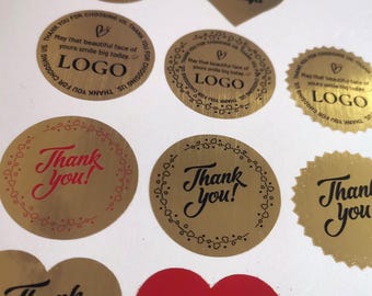 May include: A collection of gold and red stickers with various designs and text. Some stickers are round, others heart-shaped, and some have scalloped edges. Text includes "Thank You!", "LOGO", and "Handmade by Maya".