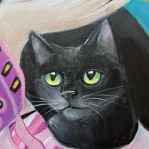 May include: A close-up painting of a black cat with bright green eyes. The cat is wearing a pink and white striped scarf. A hand is gently touching the cat's head. The background is a mix of colors.