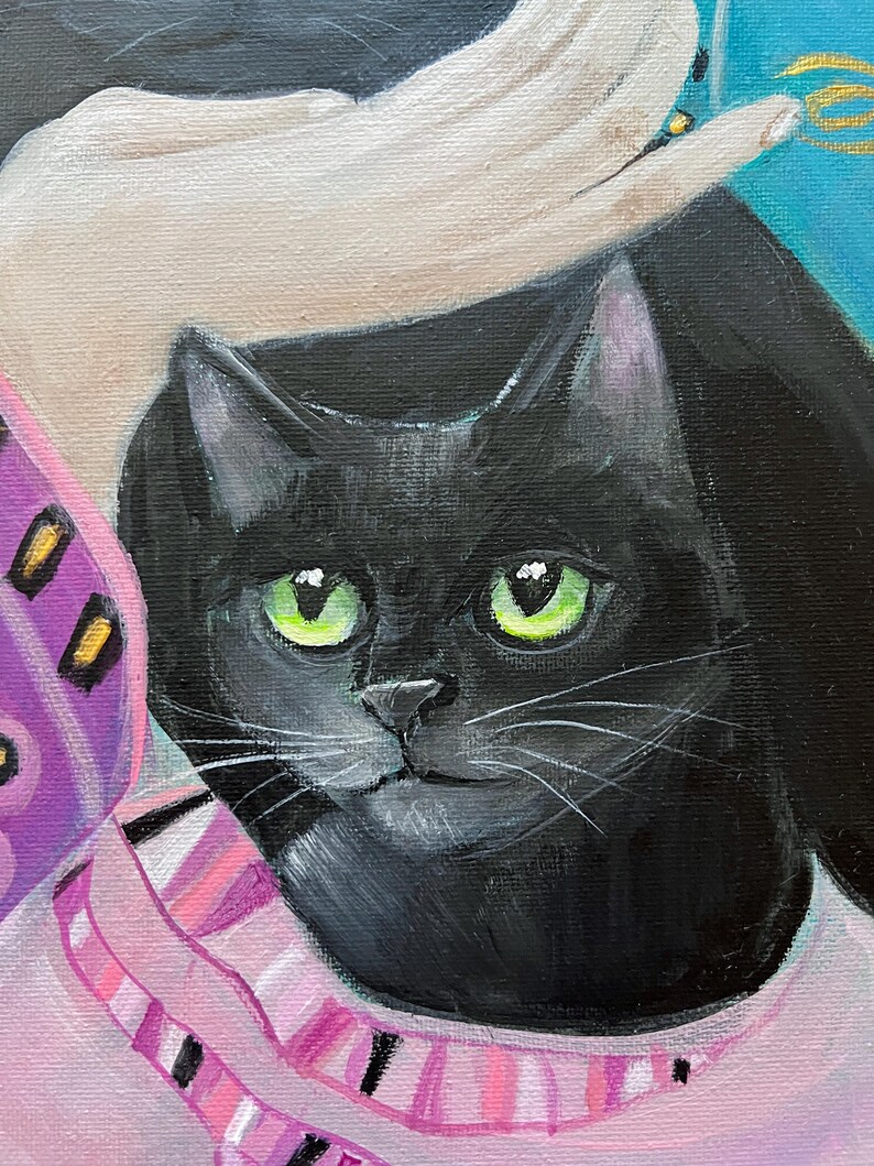 May include: A close-up painting of a black cat with bright green eyes. The cat is wearing a pink and white striped scarf. A hand is gently touching the cat's head. The background is a mix of colors.