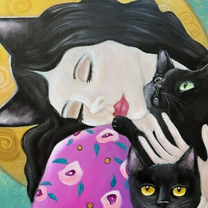 May include: An original painting of a woman with black hair and cat ears, embracing two black cats. The woman wears a pink dress with a floral pattern. The background features a yellow circle and blue accents.