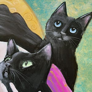 May include: An artistic painting featuring two black cats with expressive eyes. One cat has blue eyes, the other green. The background is a mix of teal and gold, with a pink and gold accent.