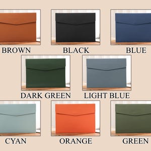May include: Eight coloured document holders are displayed, each with a flap closure. The colours are brown, black, blue, dark green, light blue, cyan, orange, and green. Each holder is presented on a wooden surface. Text labels identify each colour.