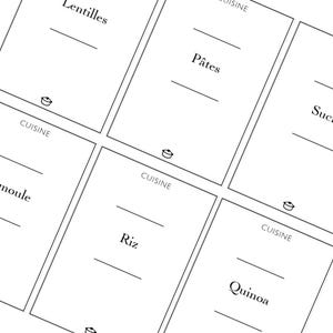 May include: A set of white rectangular labels with black text, designed for kitchen organisation. Each label has a horizontal line for writing and the word "CUISINE" at the bottom. The labels are labelled with food names such as "Lentils", "Pasta", "Rice", and "Quinoa".