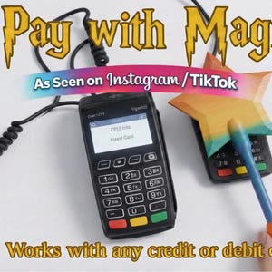 May include: Two black card readers are shown with a star-shaped wand. The image includes the text "Pay with Magic" and "As Seen on Instagram/TikTok". The card readers display "Insert Card" on their screens. The text "Works with any credit or debit card" is also visible.