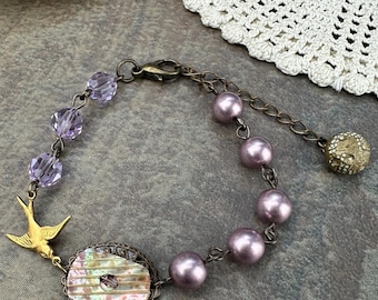 Vintage Button Bracelet with Swallow Charm / Lavender Pearl Jewelry / Cottagelcore Bird Charm Bracelet / Antique Style Filigree Gift for Her