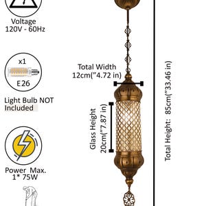 May include: A brass-colored pendant light with a cylindrical glass shade featuring a diamond-patterned metal overlay. It has a total height of 33.46 inches, a width of 4.72 inches, and a glass height of 7.87 inches. Requires one E26 75W bulb.