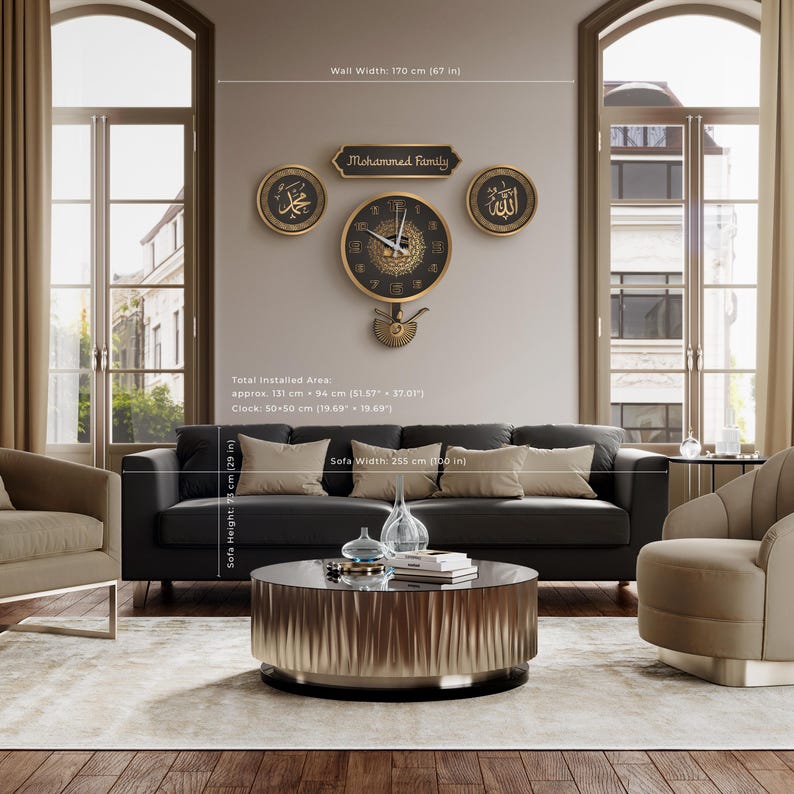 May include: A living room with a black sofa, beige cushions, and a round coffee table. Above the sofa, a wall clock and decorative pieces with Arabic script and the text "Mohammed Family" are displayed. The clock is approximately 50 cm in diameter.
