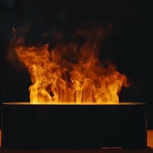 Peut inclure: Une base rectangulaire noire avec un effet de flamme émanant du centre. Les flammes sont orange et jaunes et semblent danser.