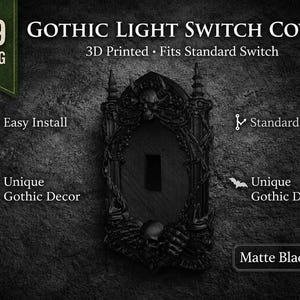 May include: A matte black PLA Gothic light switch cover with a detailed, ornate design. The cover is 3D printed and fits a standard US size switch. The design includes skulls and a bat motif.