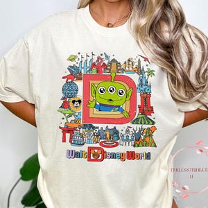 Maglietta Alien di Walt Disney World / Maglietta Cartolina Pixar retrò / Top Alien di Toy Story con colori comfort / Completo per il parco Disney / Idea regalo per le vacanze