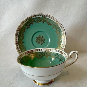 A vintage fine bone china teacup and saucer from Shelley, England. The pattern number 0520 indicates that this set is produced 1938-1945