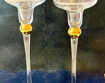 JCPenney Home Collection Celebration Candle set is a vintage-style  set of two glass candle holders designed with a gold ball on the stem.
