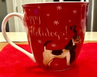 A "Happy Holidogs!" porcelain coffee mug made by the brand Milly Green.