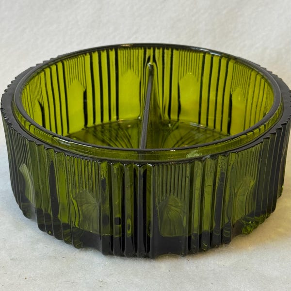 A vintage Indiana Glass Royal pattern divided candy dish in an olive green color