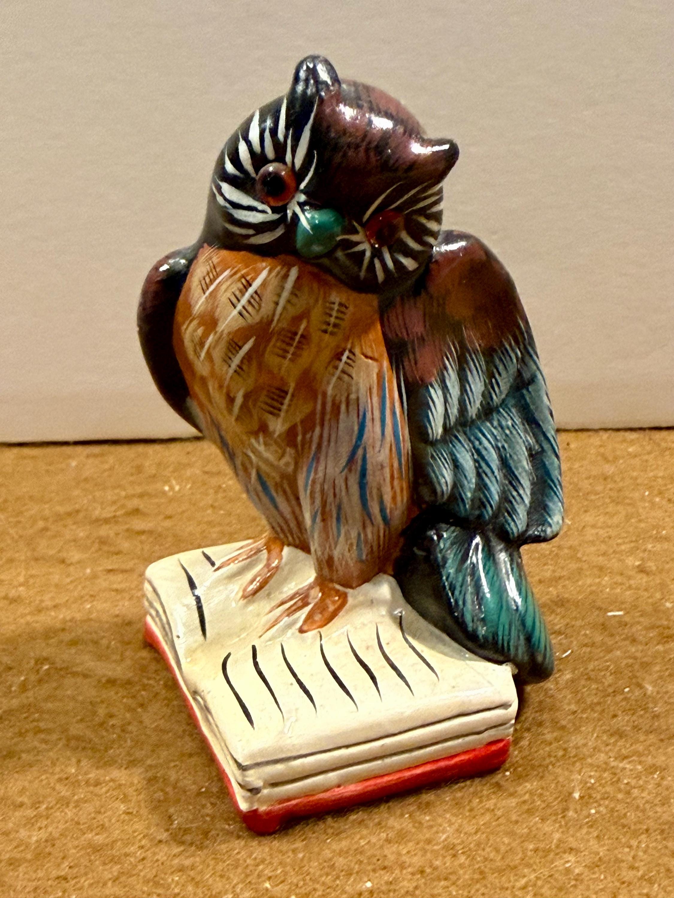 Vintage hand-painted ceramic or chalkware owl figurine perched on a book