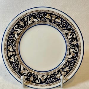 Set of Six bread and butter plates. a Wedgwood Florentine Dark Blue (W1956) bone china plate featuring a white center and a detailed border