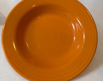 Set of four pieces of Fiesta (Fiestaware) dinnerware soup or salad bowls manufactured by the Homer Laughlin China Company.