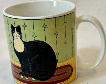 Sakura "Cat Collection" ceramic coffee mug designed by artist Warren Kimble, featuring a tuxedo cat illustration
