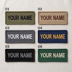 May include: Six rectangular embroidered patches in various colors: olive green, tan, gray, navy blue, black, and dark green. Each patch has the text "YOUR NAME" in a contrasting color.