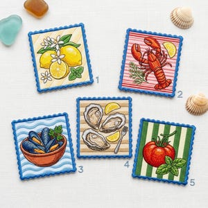 May include: Five square coasters with scalloped blue edges featuring illustrations: lemons with blossoms, a red lobster, a bowl of blue mussels, oysters with a fork and lemon wedges, and a red tomato with green basil leaves on a striped background.
