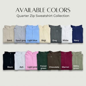 May include: A collection of quarter-zip sweatshirts in various colors, including sand, sport grey, light blue, begi, grey, white, navy, black, ash, light pink, forest green, chocolate, marron, and milita green. The text "AVAILABLE COLORS" and "Quarter Zip Sweatshirt Collection" are displayed.