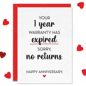 May include: A white greeting card with a red envelope border featuring black text that reads: YOUR 1 year WARRANTY HAS expired. SORRY, no returns. HAPPY ANNIVERSARY. A small red heart is printed below the final line of text on the card.