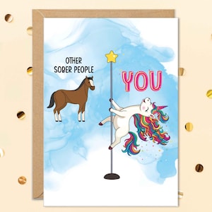 May include: Greeting card with a brown horse and a unicorn pole dancing. The text reads "Other Sober People" and "YOU" in pink bubble letters. The background is a blue watercolor design.