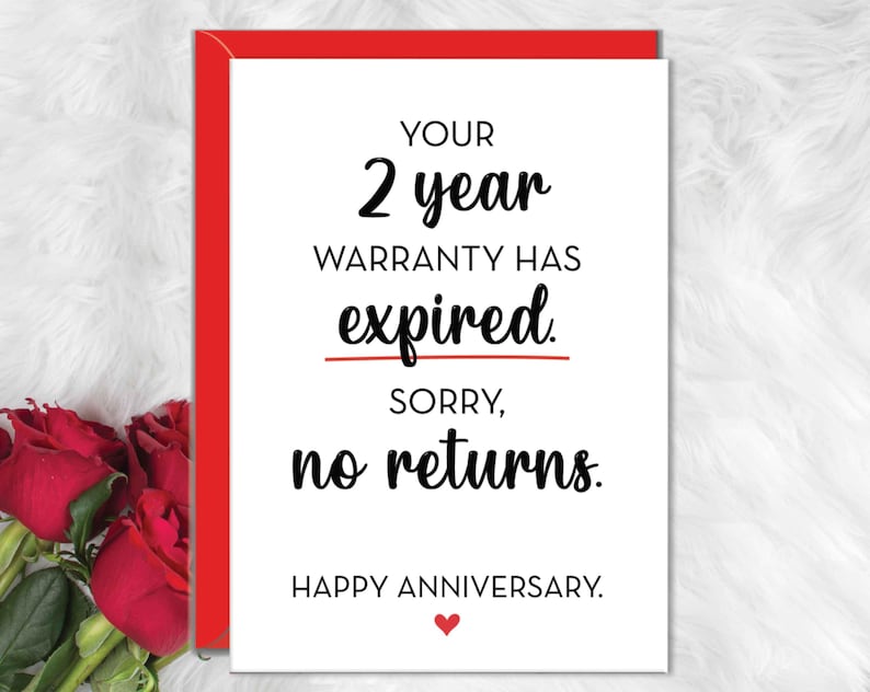 May include: A white greeting card with a red envelope featuring the black text: YOUR 2 year WARRANTY HAS expired. SORRY, no returns. HAPPY ANNIVERSARY. A small red heart is printed below the text, and red roses are visible on the left side.