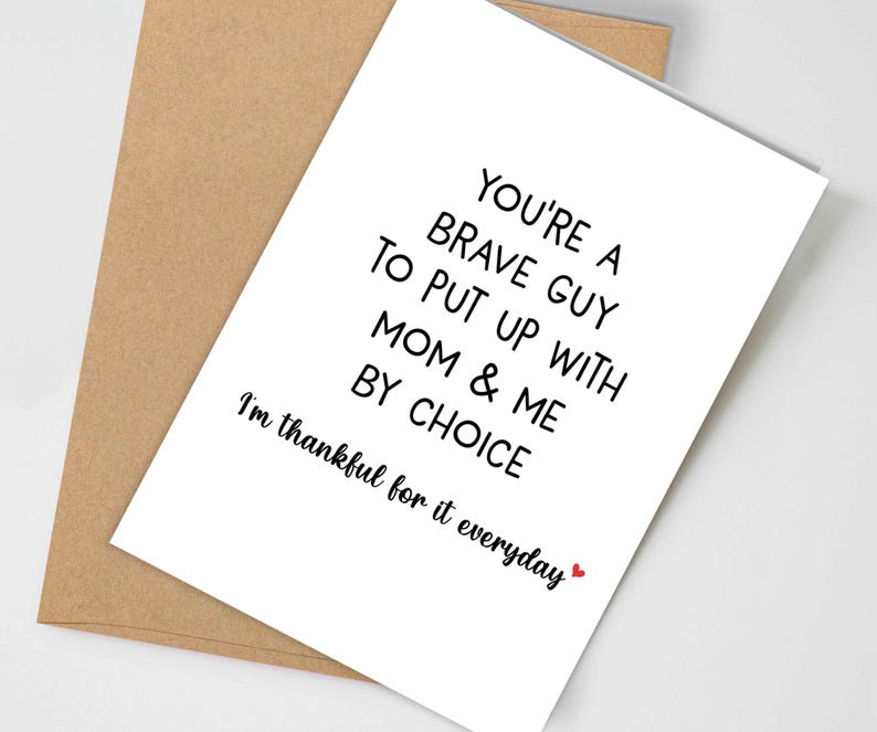 May include: A white greeting card with black text that reads "YOU'RE A BRAVE GUY TO PUT UP WITH MOM & ME BY CHOICE. I'm thankful for it everyday" with a small red heart. The card is inside a brown envelope.
