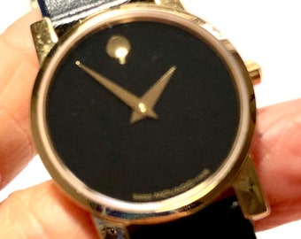 Vintage Ladies Museum Classic Movado Watch, Black Watch Face, Gold Hands and Case, Distinctive Gold Dot, Original Box, Black Strap, Sm Wrist