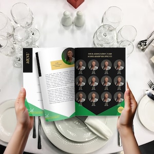May include: A person holding open a menu with a black and gold cover. The menu features a photo of a woman and text. The right page has photos of other women. The menu is on a white tablecloth with silverware and glasses.