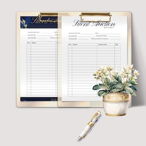 May include: Two clipboards with "Silent Auction" bid sheets, a pen, and a potted plant. The bid sheets have spaces for item details, starting bids, and bidder information. The pen is white and gold. The plant has white flowers.