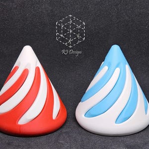 May include: Two cone-shaped objects with a spiral design. One cone features red and white sections, while the other features light blue and white sections. Above the cones, a white geometric logo and the text RJ Design are clearly visible.