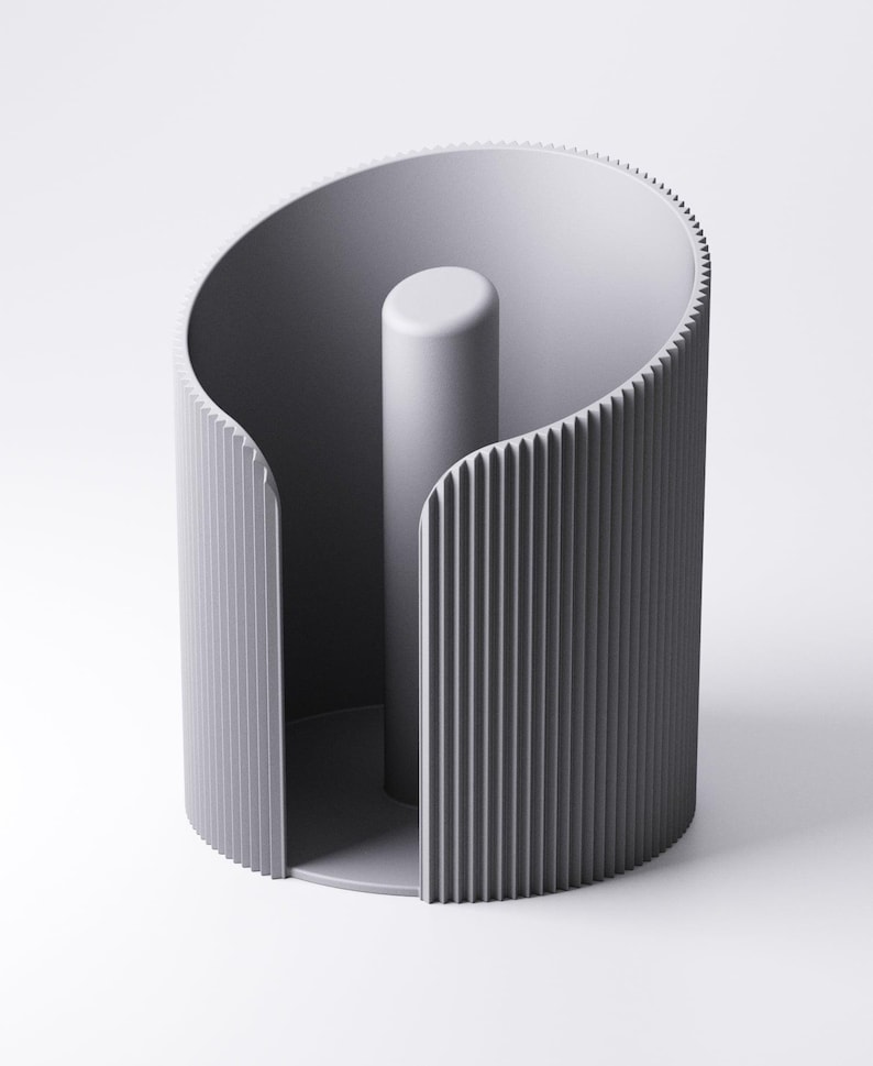 May include: A contemporary grey paper towel holder. It features a central cylindrical post and a curved, ridged outer design. The minimalist aesthetic emphasises form and function. The holder is constructed from a solid, matte material.