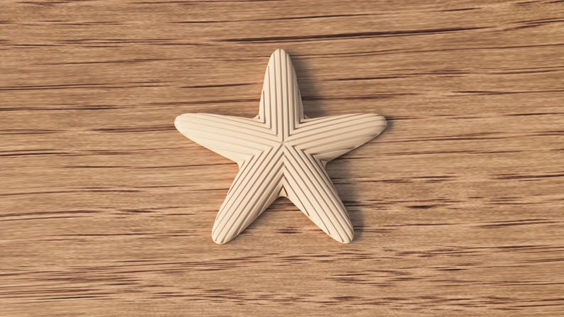 May include: A cream-colored starfish with etched lines, resting on a wooden surface. The five-pointed star has a textured appearance, with each point displaying parallel grooves. The background is a light brown wood grain.