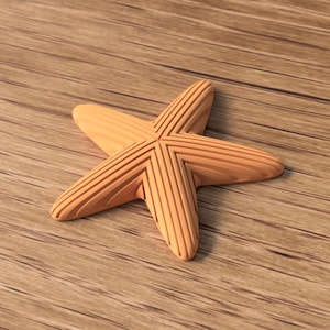 May include: A wooden starfish with a light brown color and a grooved design on each arm. The starfish is lying on a wooden surface with a similar color and wood grain pattern. The starfish is a decorative item.