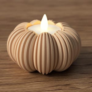 May include: A decorative candle holder shaped like a pumpkin, made of light-colored wood. The candle holder has vertical grooves and holds a small, glowing LED candle with a flickering flame. The candle holder sits on a wooden surface.