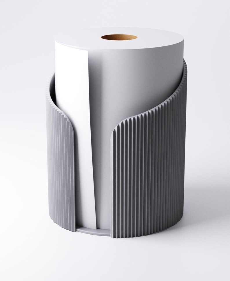 May include: A contemporary grey toilet roll holder with a vertical ribbed pattern. It encases a white toilet roll, with some paper visible. The design is minimalist and modern, suitable for a bathroom.