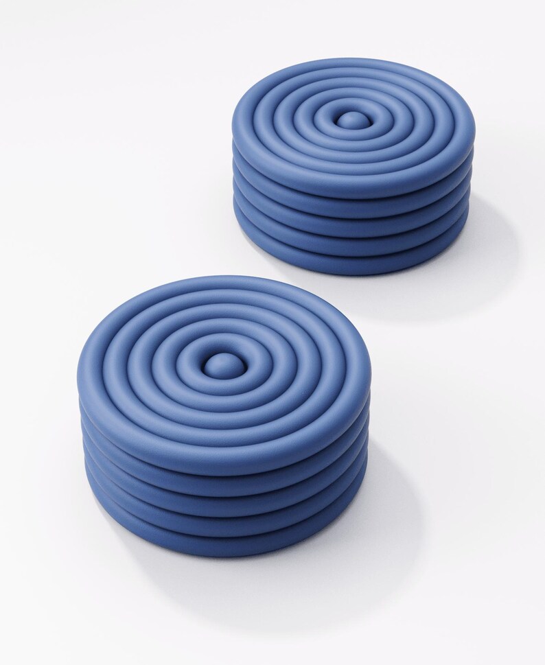 May include: Two blue, circular objects with a spiral design. Each object is made of stacked, concentric rings, creating a layered effect. The objects are on a white background.
