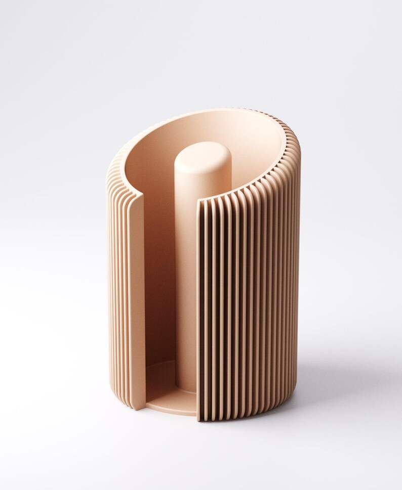 May include: A peach-colored, modern paper towel holder. The holder has a cylindrical design with vertical slats and a central, solid post. The top is curved, and the base is a solid, rounded shape. The design is minimalist and contemporary.
